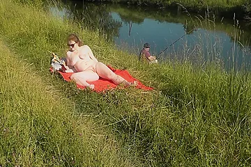 Nudist Beach. Public Nudity. Sexy Milf Without Panties And Bra Sunbathes Naked Is Not Shy About Fisherman. Naked In Public. Milf - porn video